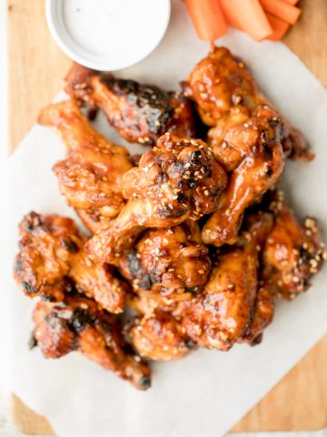 Sweet and sticky, baked BBQ chicken wings are perfectly crispy, so delicious, and smothered in barbecue sauce. They are the perfect game day appetizer. | aheadofthyme.com