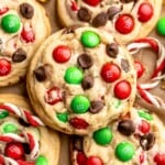 Festive red and green M&M Christmas Cookies that are soft, chewy, and crisp at the edges. Quick and easy, ready in about 20 minutes. | aheadofthyme.com