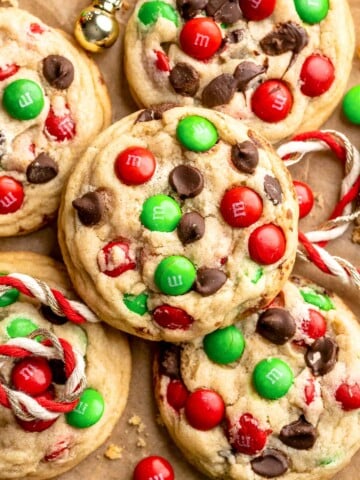 Festive red and green M&M Christmas Cookies that are soft, chewy, and crisp at the edges. Quick and easy, ready in about 20 minutes. | aheadofthyme.com