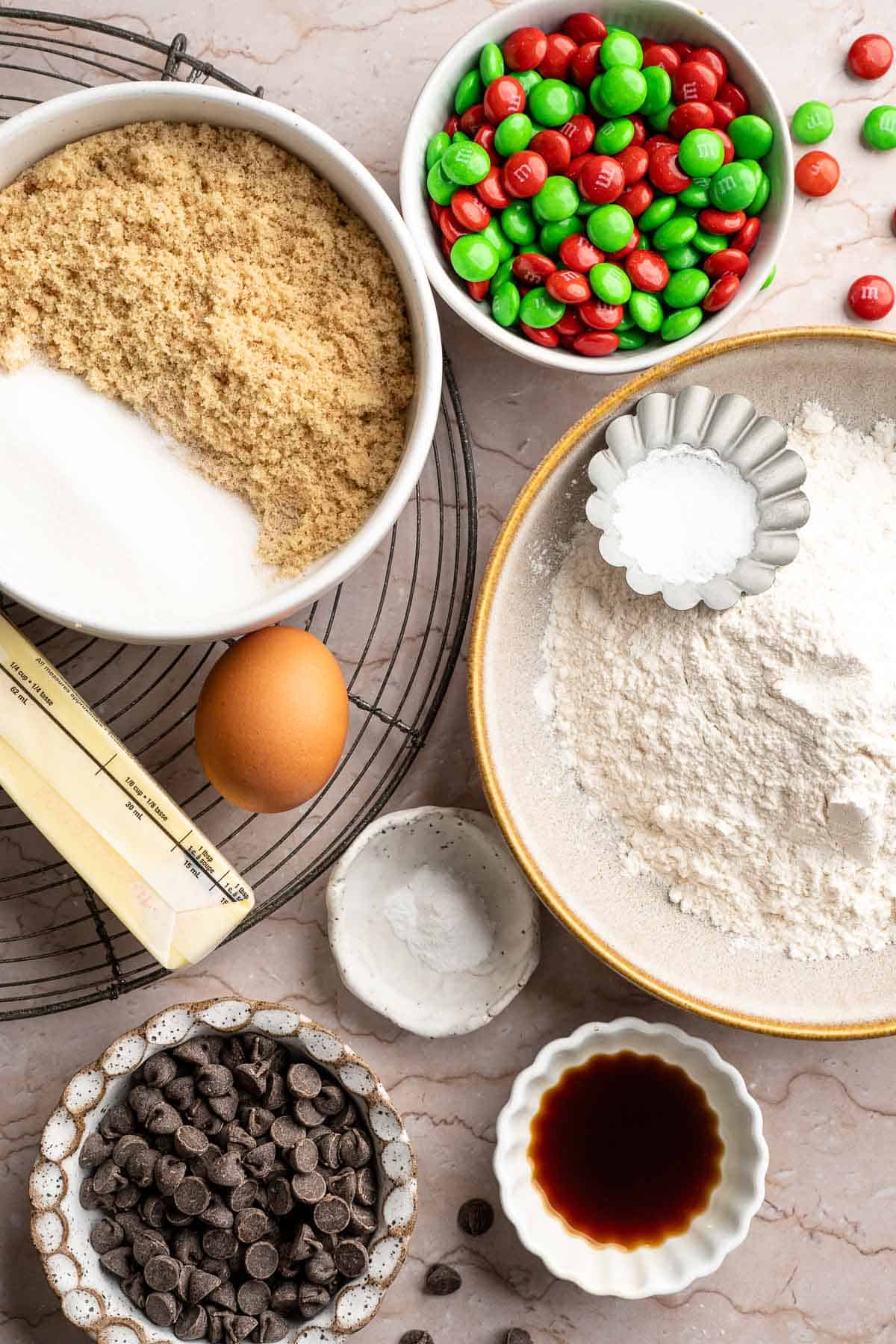 Festive red and green M&M Christmas Cookies that are soft, chewy, and crisp at the edges. Quick and easy, ready in about 20 minutes. | aheadofthyme.com