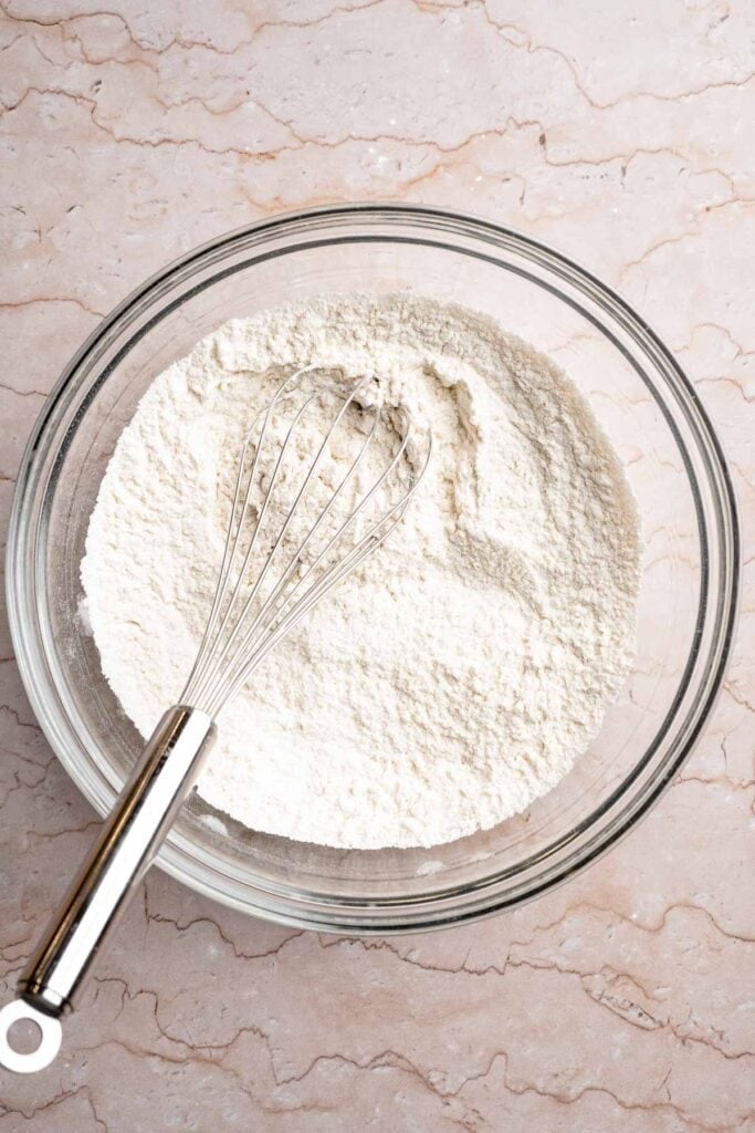 Festive red and green M&M Christmas Cookies that are soft, chewy, and crisp at the edges. Quick and easy, ready in about 20 minutes. | aheadofthyme.com