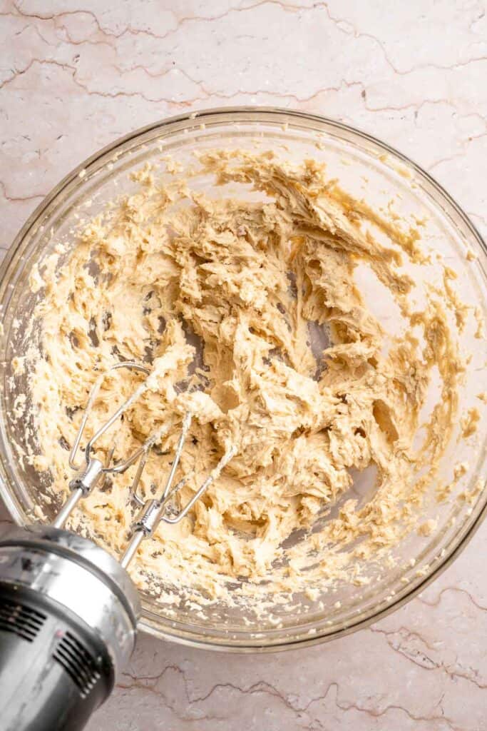 Festive red and green M&M Christmas Cookies that are soft, chewy, and crisp at the edges. Quick and easy, ready in about 20 minutes. | aheadofthyme.com