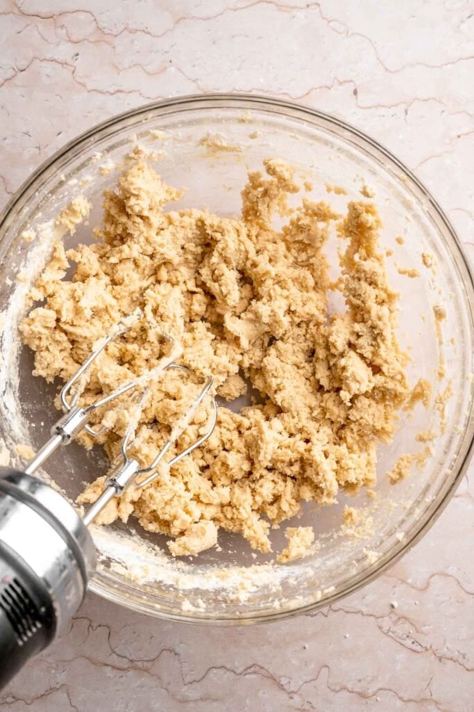 Festive red and green M&M Christmas Cookies that are soft, chewy, and crisp at the edges. Quick and easy, ready in about 20 minutes. | aheadofthyme.com