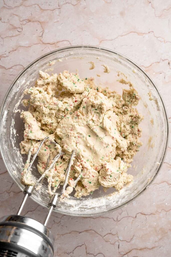 Funfetti Christmas shortbread cookie bites are squares of buttery melt in your mouth mini cookies packed with festive sprinkles for a fun holiday treat. | aheadofthyme.com