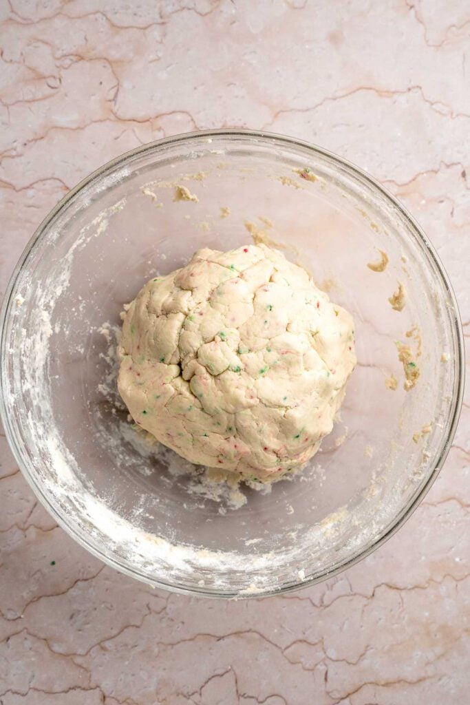 Funfetti Christmas shortbread cookie bites are squares of buttery melt in your mouth mini cookies packed with festive sprinkles for a fun holiday treat. | aheadofthyme.com