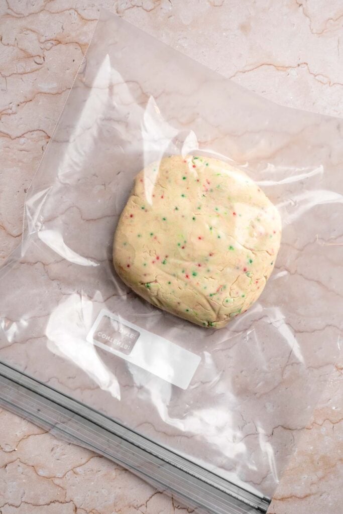 Funfetti Christmas shortbread cookie bites are squares of buttery melt in your mouth mini cookies packed with festive sprinkles for a fun holiday treat. | aheadofthyme.com