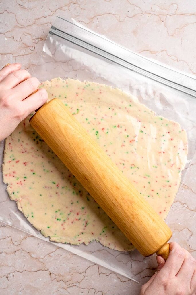 Funfetti Christmas shortbread cookie bites are squares of buttery melt in your mouth mini cookies packed with festive sprinkles for a fun holiday treat. | aheadofthyme.com