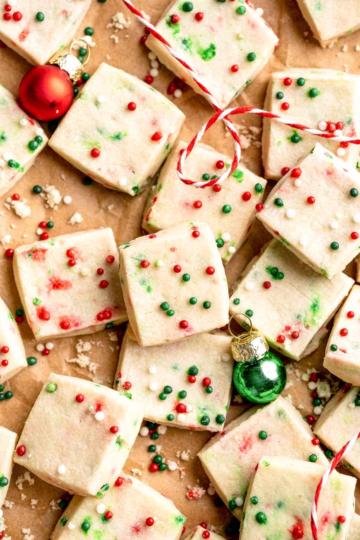 Funfetti Christmas shortbread cookie bites are squares of buttery melt in your mouth mini cookies packed with festive sprinkles for a fun holiday treat. | aheadofthyme.com