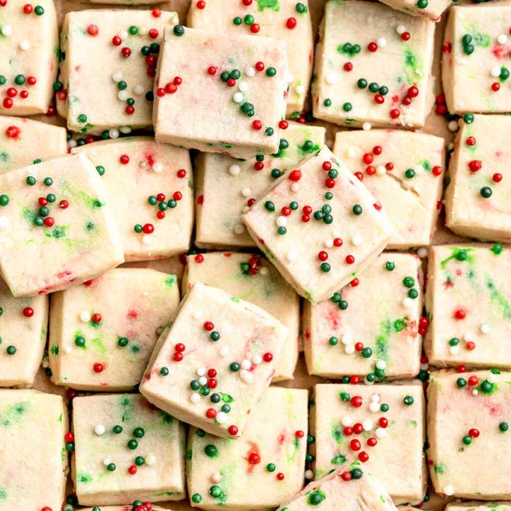 Funfetti Christmas shortbread cookie bites are squares of buttery melt in your mouth mini cookies packed with festive sprinkles for a fun holiday treat. | aheadofthyme.com