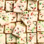 Funfetti Christmas shortbread cookie bites are squares of buttery melt in your mouth mini cookies packed with festive sprinkles for a fun holiday treat. | aheadofthyme.com