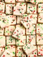 Funfetti Christmas shortbread cookie bites are squares of buttery melt in your mouth mini cookies packed with festive sprinkles for a fun holiday treat. | aheadofthyme.com