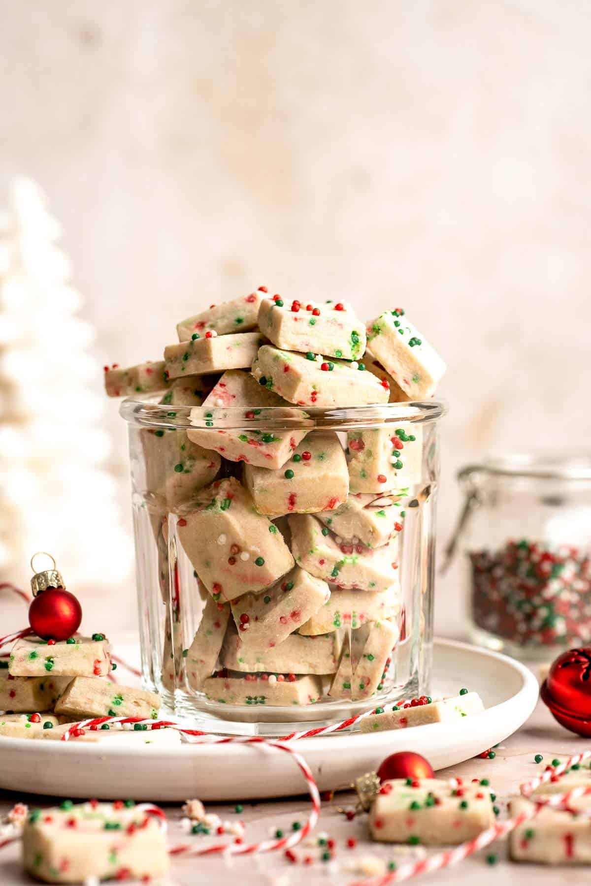 Funfetti Christmas shortbread cookie bites are squares of buttery melt in your mouth mini cookies packed with festive sprinkles for a fun holiday treat. | aheadofthyme.com