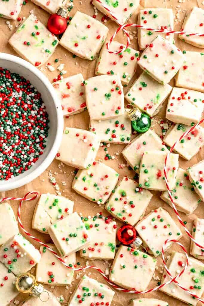 Funfetti Christmas shortbread cookie bites are squares of buttery melt in your mouth mini cookies packed with festive sprinkles for a fun holiday treat. | aheadofthyme.com
