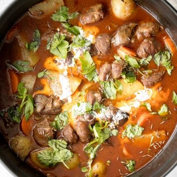 Hearty coconut lamb curry is an easy one pot meal that is packed with flavour. Make it on the stovetop or in the slow cooker and freeze leftovers for later. | aheadofthyme.com