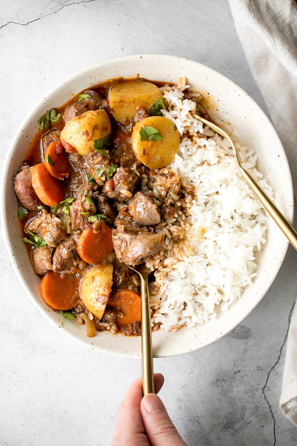 Hearty coconut lamb curry is an easy one pot meal that is packed with flavour. Make it on the stovetop or in the slow cooker and freeze leftovers for later. | aheadofthyme.com