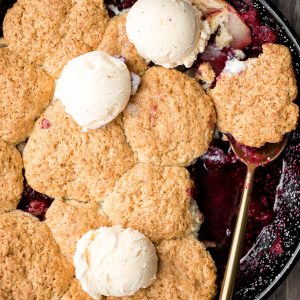 Sweet and tart cranberry-apple cobbler with biscuits is packed with fresh fruit and a buttery biscuit topping. This holiday favourite is easy to make. | aheadofthyme.com