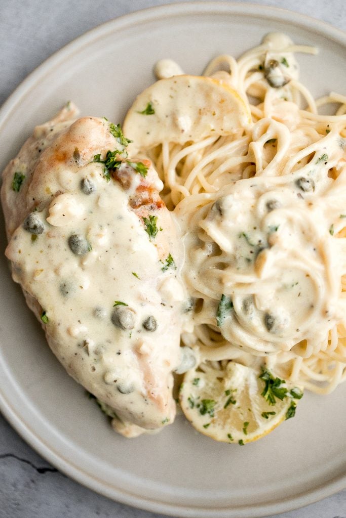 Creamy lemon parmesan chicken is a simple, quick and easy 30-minute meal that is packed with flavour. The most comforting and easiest weeknight dinner. | aheadofthyme.com