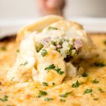 Easy creamy ham and potatoes au gratin is a great way to use leftover ham with tender sliced potatoes and a cheesy béchamel sauce. The best comfort food. | aheadofthyme.com