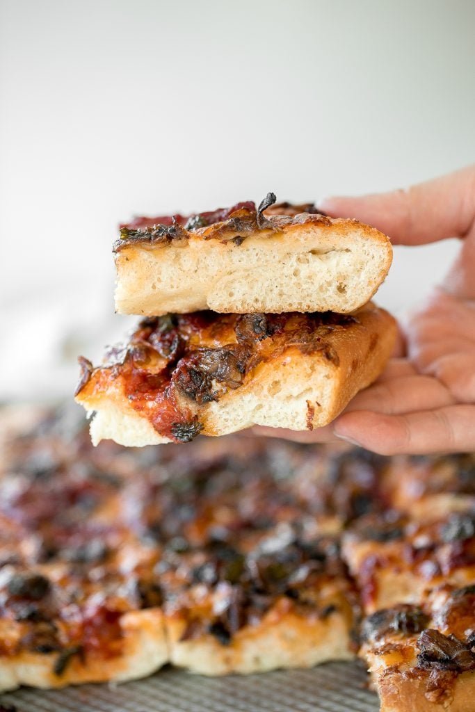 Sheet pan garlic mushroom focaccia pizza with a thick pillowy and crispy crust is topped with sautéed garlic mushrooms, melty mozzarella and lots of basil. | aheadofthyme.com