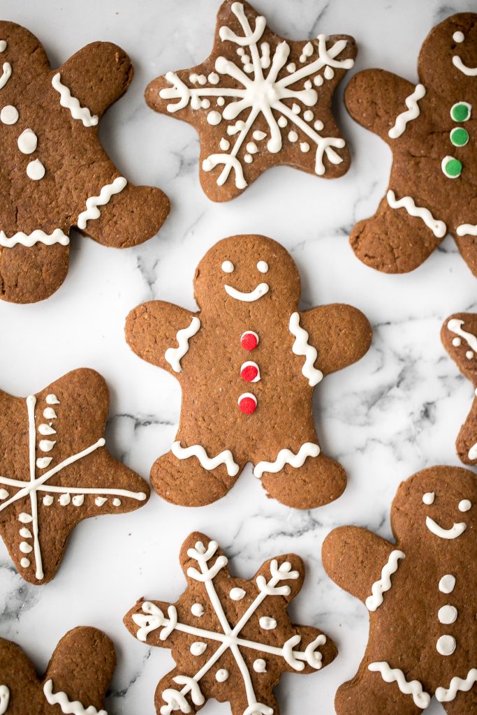 Classic gingerbread cookies with royal icing are soft and chewy in the centre but crisp on the edges. Add these festive cookies to your holiday baking list. | aheadofthyme.com