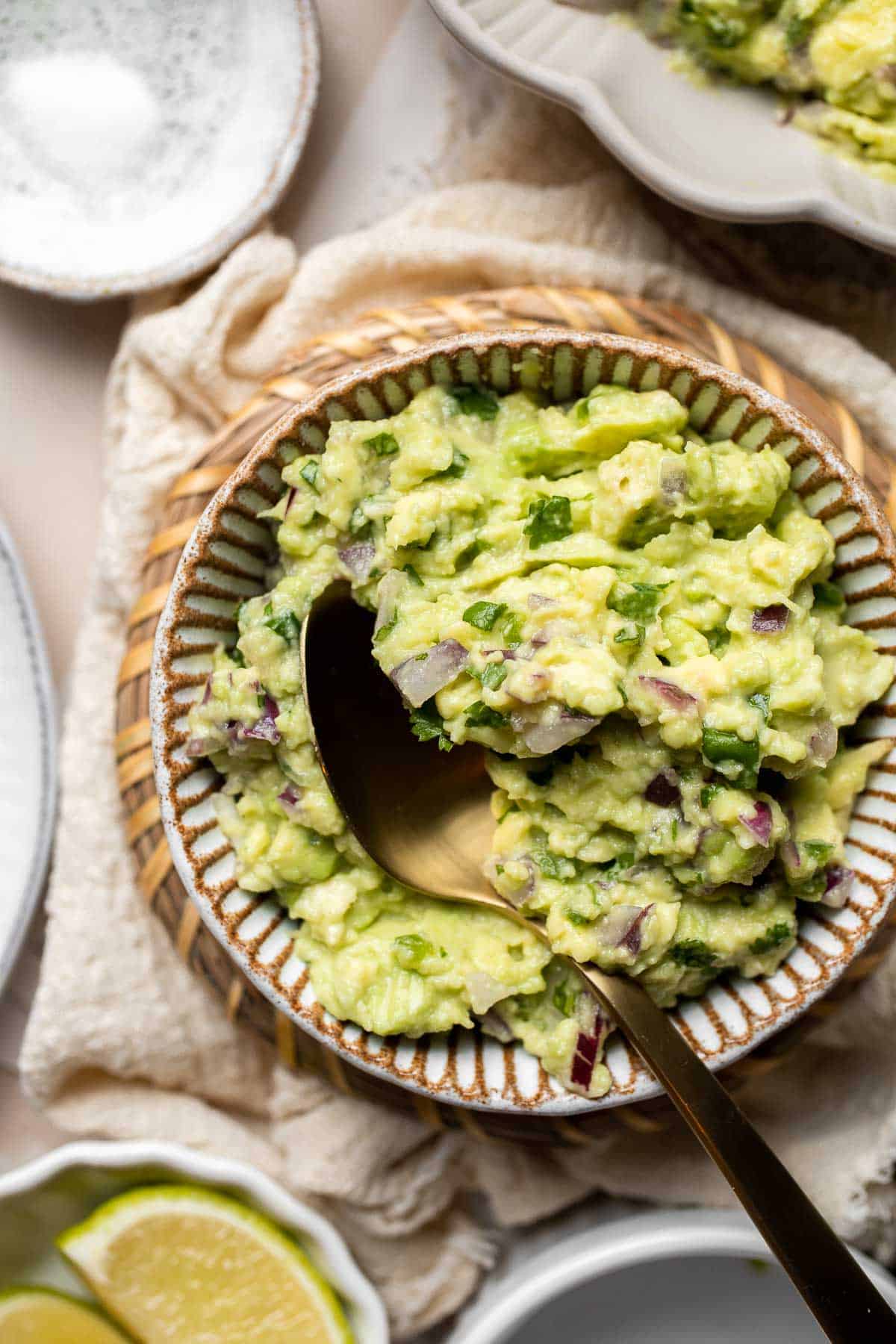 This authentic Guacamole recipe is quick and easy to make at home with just a few simple ingredients and 5 minutes of time. It's fresh and flavorful. | aheadofthyme.com