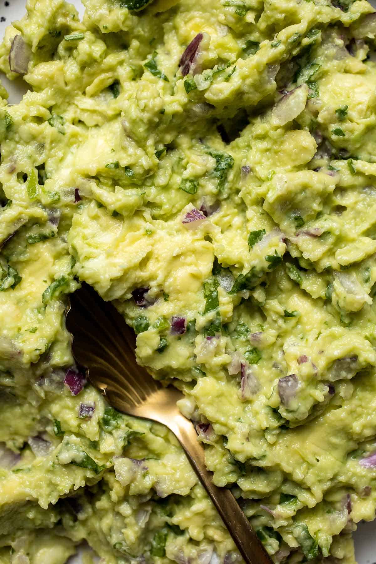 This authentic Guacamole recipe is quick and easy to make at home with just a few simple ingredients and 5 minutes of time. It's fresh and flavorful. | aheadofthyme.com