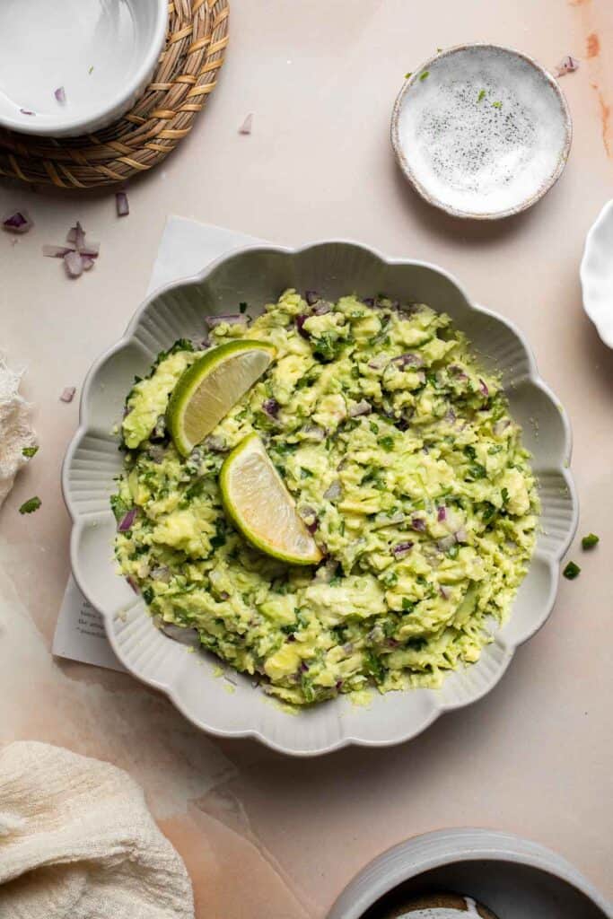 This authentic Guacamole recipe is quick and easy to make at home with just a few simple ingredients and 5 minutes of time. It's fresh and flavorful. | aheadofthyme.com