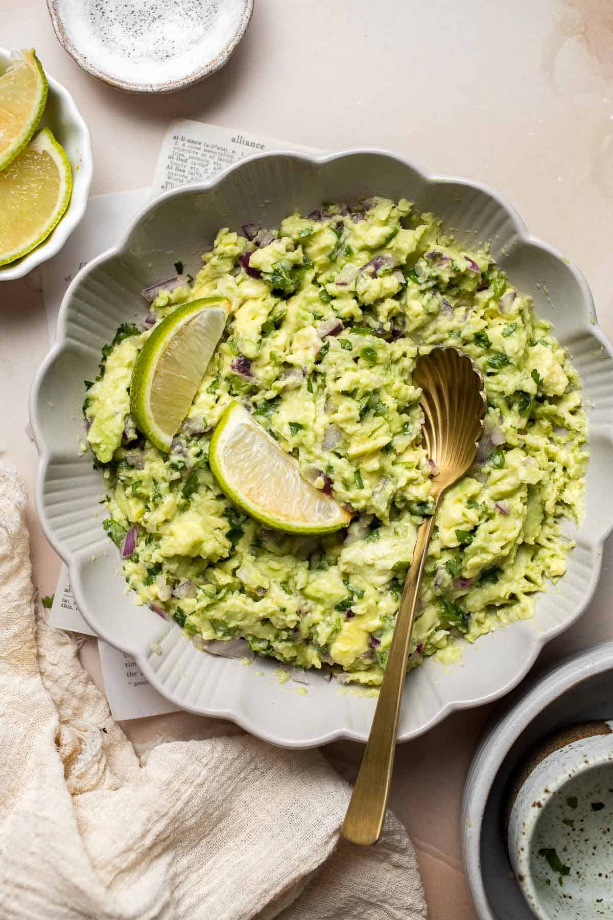 This authentic Guacamole recipe is quick and easy to make at home with just a few simple ingredients and 5 minutes of time. It's fresh and flavorful. | aheadofthyme.com