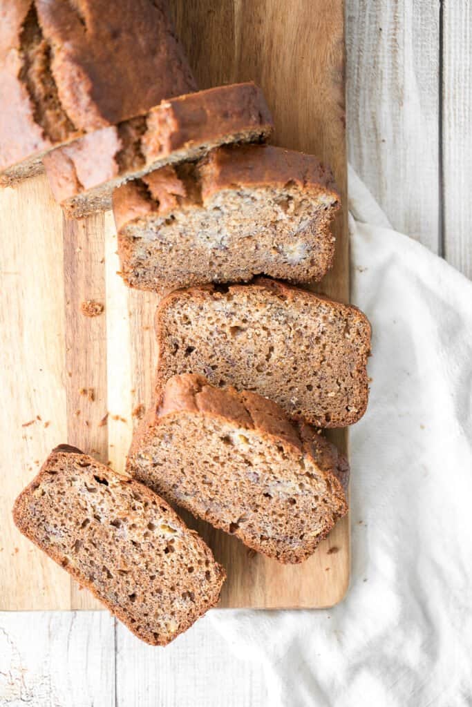 Healthy banana bread is delicious and moist and contains no refined sugar or butter. Quick and easy to make with 10 minutes prep and few pantry staples. | aheadofthyme.com