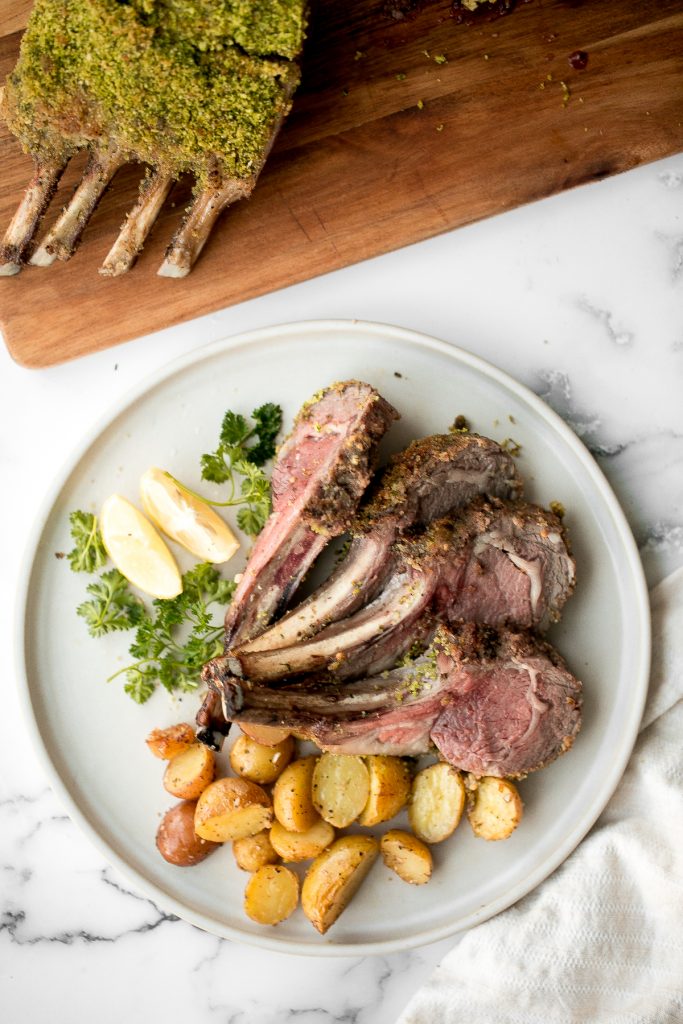 This delicious garlic and herb-crusted rack of lamb is tender, juicy, and flavourful. It is surprisingly quick and easy to make at home in about 30 minutes. | aheadofthyme.com