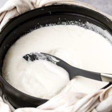 Thick and creamy homemade yogurt is so easy to make at home with just 2 ingredients, a heavy pot, and just a few minutes of actual hands on prep work. | aheadofthyme.com