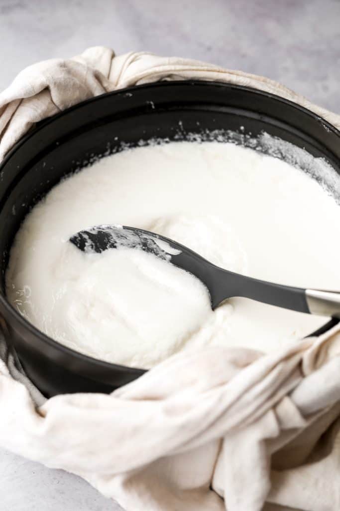 Thick and creamy homemade yogurt is so easy to make at home with just 2 ingredients, a heavy pot, and just a few minutes of actual hands on prep work. | aheadofthyme.com