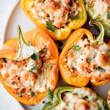 Leftover turkey stuffed peppers are a nutritious, wholesome and healthy dinner that you can throw together easily and quickly. A total crowd-pleaser. | aheadofthyme.com