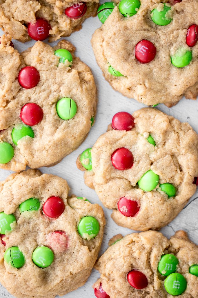Festive red and green M&M Christmas cookies are super soft and chewy with the crispiest edges. Quick and easy to make in 20 minutes with no chill time. | aheadofthyme.com