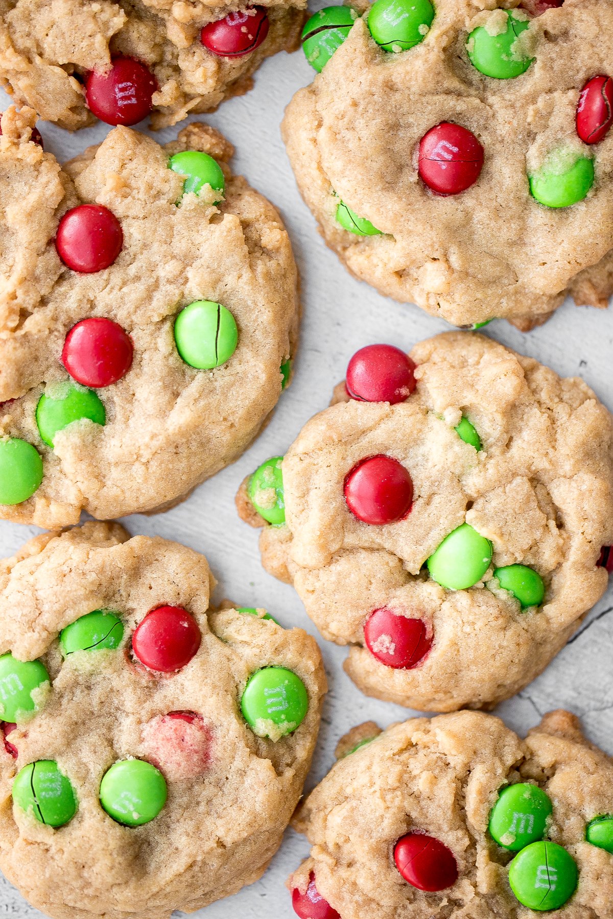 Festive red and green M&M Christmas cookies are super soft and chewy with the crispiest edges. Quick and easy to make in 20 minutes with no chill time. | aheadofthyme.com