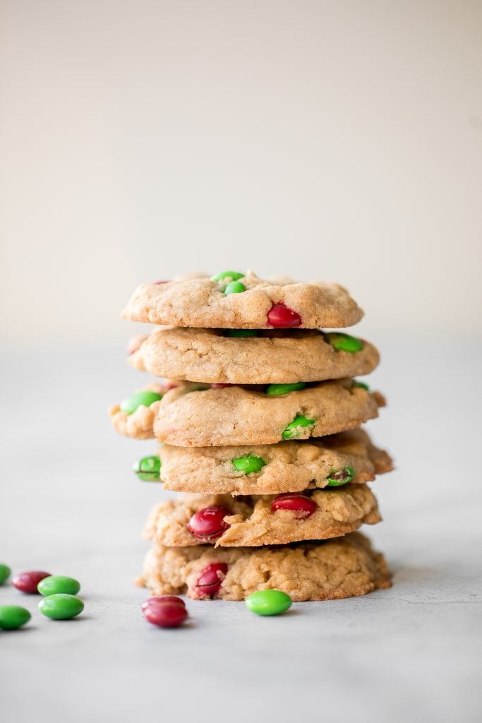 Festive red and green M&M Christmas cookies are super soft and chewy with the crispiest edges. Quick and easy to make in 20 minutes with no chill time. | aheadofthyme.com