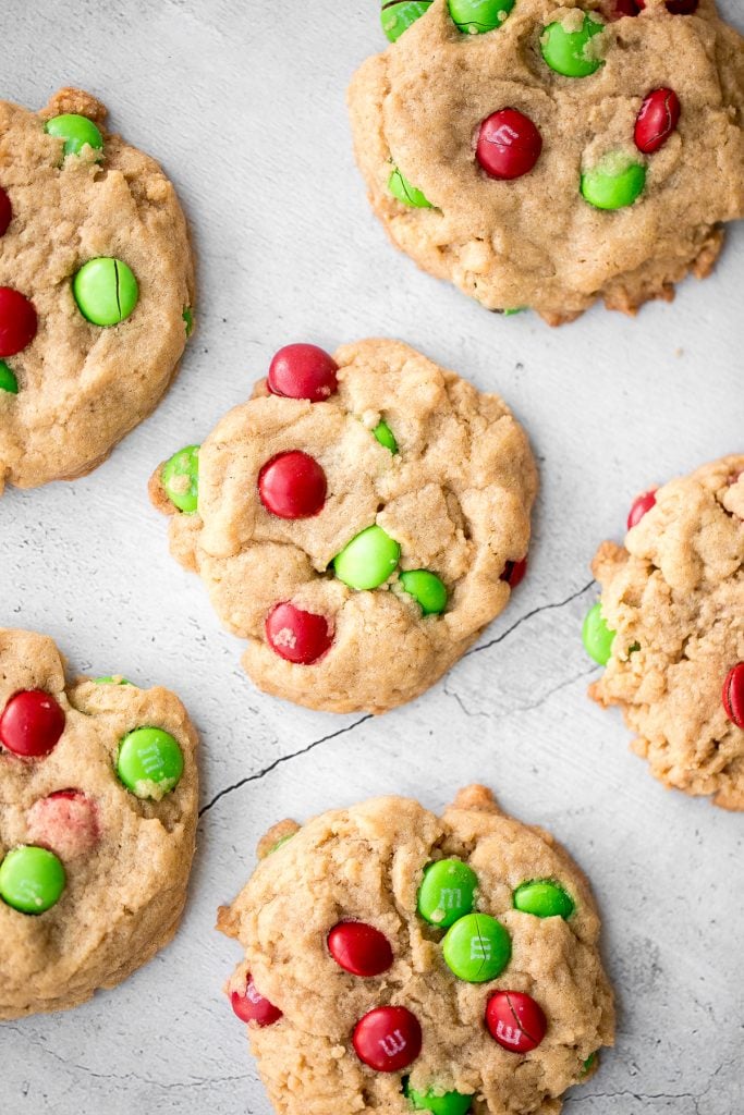 Festive red and green M&M Christmas cookies are super soft and chewy with the crispiest edges. Quick and easy to make in 20 minutes with no chill time. | aheadofthyme.com