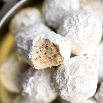 Sweet and nutty pecan snowball cookies (Russian tea cakes or Mexican wedding cookies) are little melt-in-your-mouth balls of buttery shortbread with nuts. | aheadofthyme.com