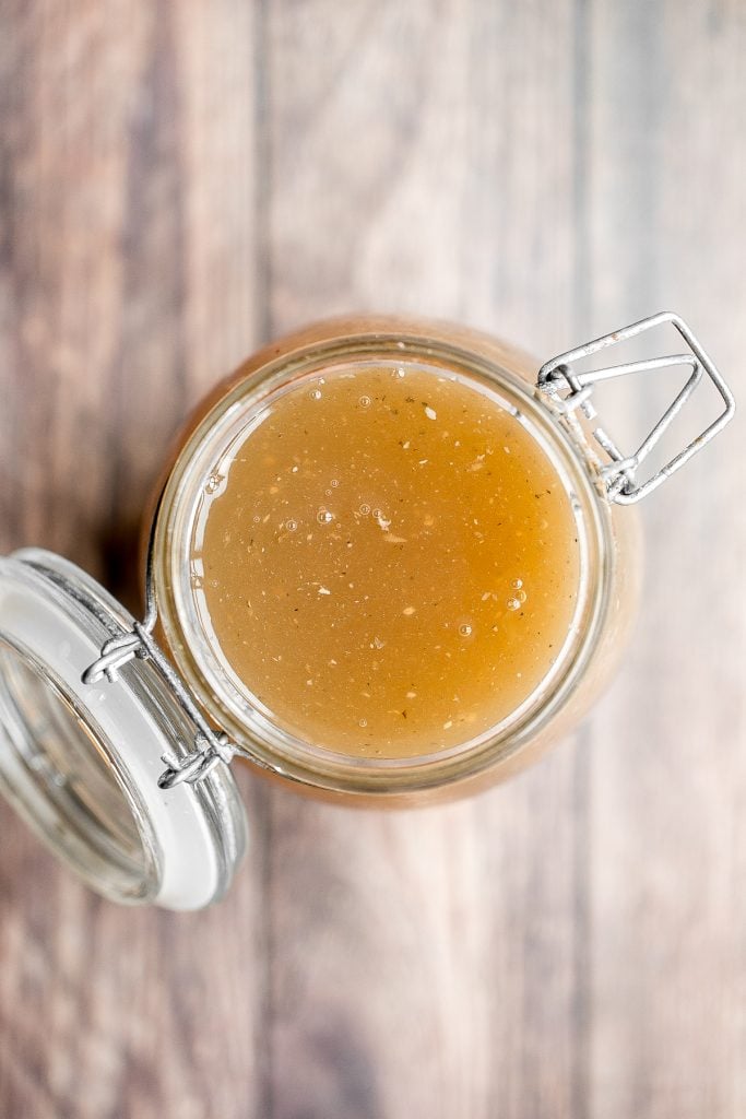 Nutritious wholesome slow cooker bone broth is healing, promotes physical wellness and health, and is easy to make at home. Add it to soups, stews and more. | aheadofthyme.com