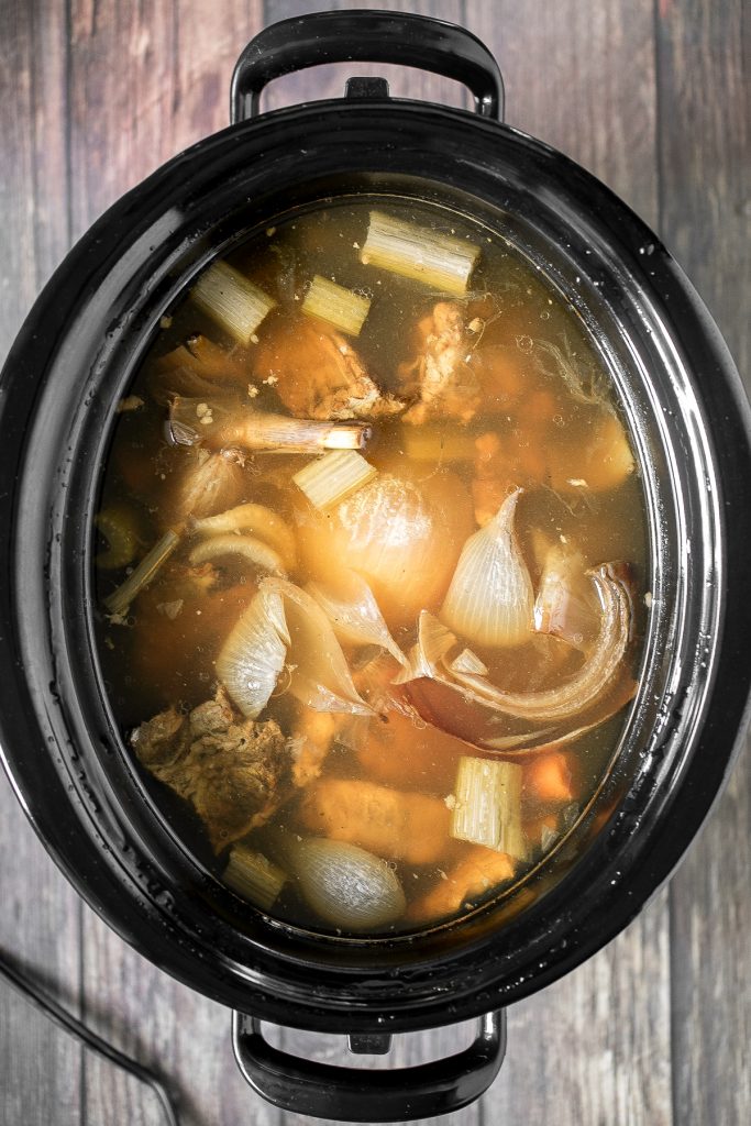 Nutritious wholesome slow cooker bone broth is healing, promotes physical wellness and health, and is easy to make at home. Add it to soups, stews and more. | aheadofthyme.com