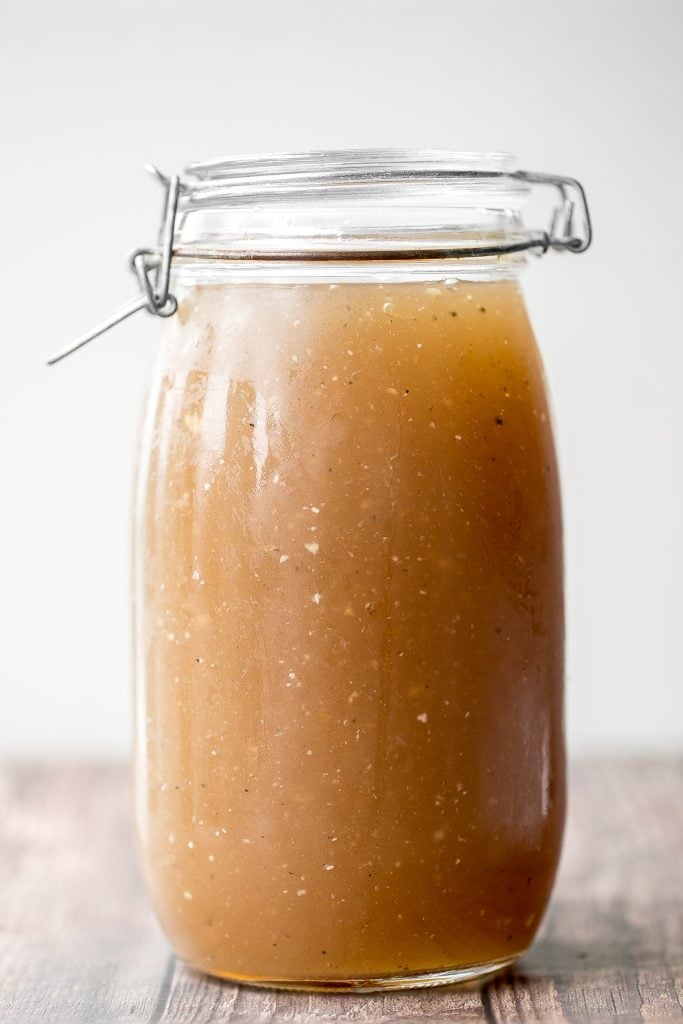 Nutritious wholesome slow cooker bone broth is healing, promotes physical wellness and health, and is easy to make at home. Add it to soups, stews and more. | aheadofthyme.com