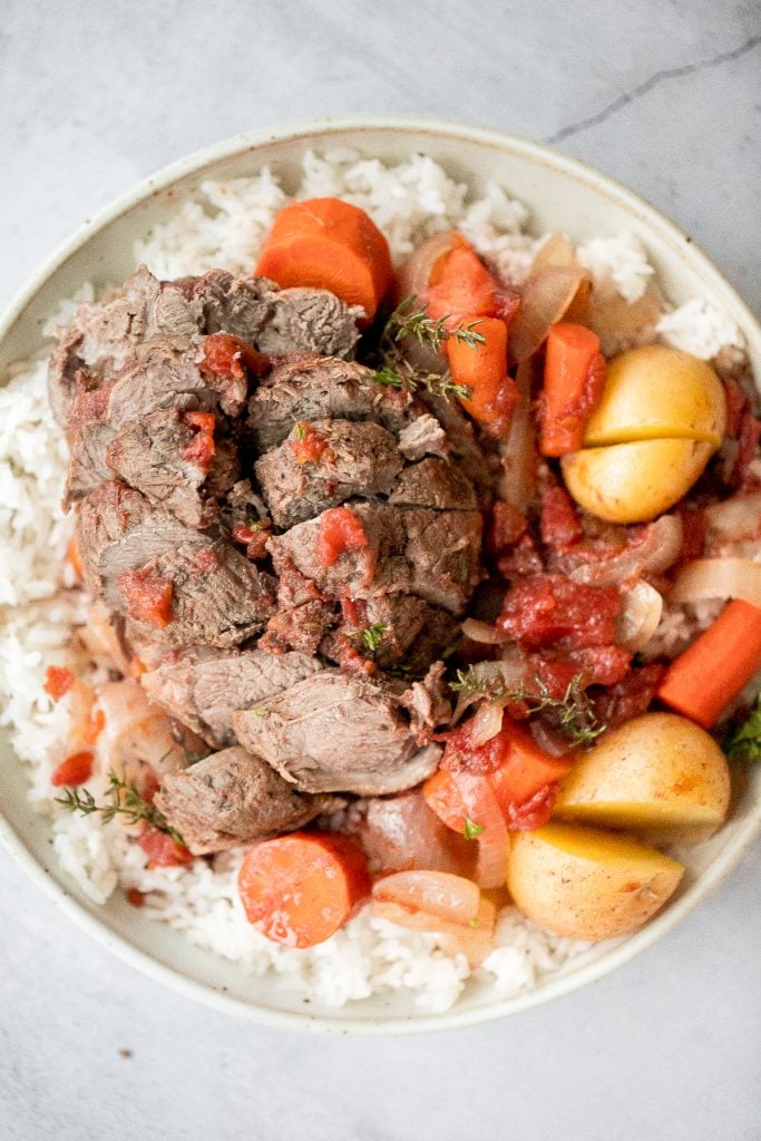 Easy Mediterranean slow cooker leg of lamb with vegetables is succulent, tender, juicy, and flavourful, seasoned with fresh herbs. Prep the crockpot in just 15 minutes. | aheadofthyme.com