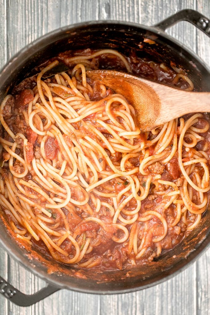 Quick easy spaghetti bolognese with a rich, thick, delicious and flavourful meat sauce is a family favourite ready in 30 minutes. Best weeknight dinner. | aheadofthyme.com