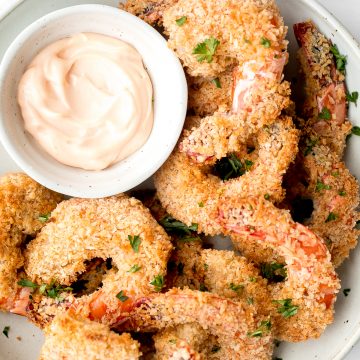 Crispy baked coconut shrimp is a delicious appetizer that is easy to make in 30 minutes. They are more flavourful, tastier and healthier than takeout. | aheadofthyme.com