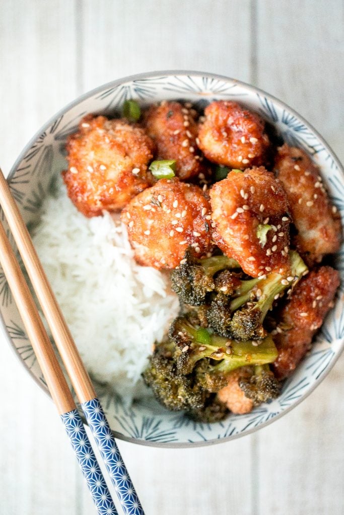 Better than takeout, baked sesame chicken with vegetables is delicious, flavourful, sticky and saucy. This healthier Chinese dish is quick and easy to make. | aheadofthyme.com