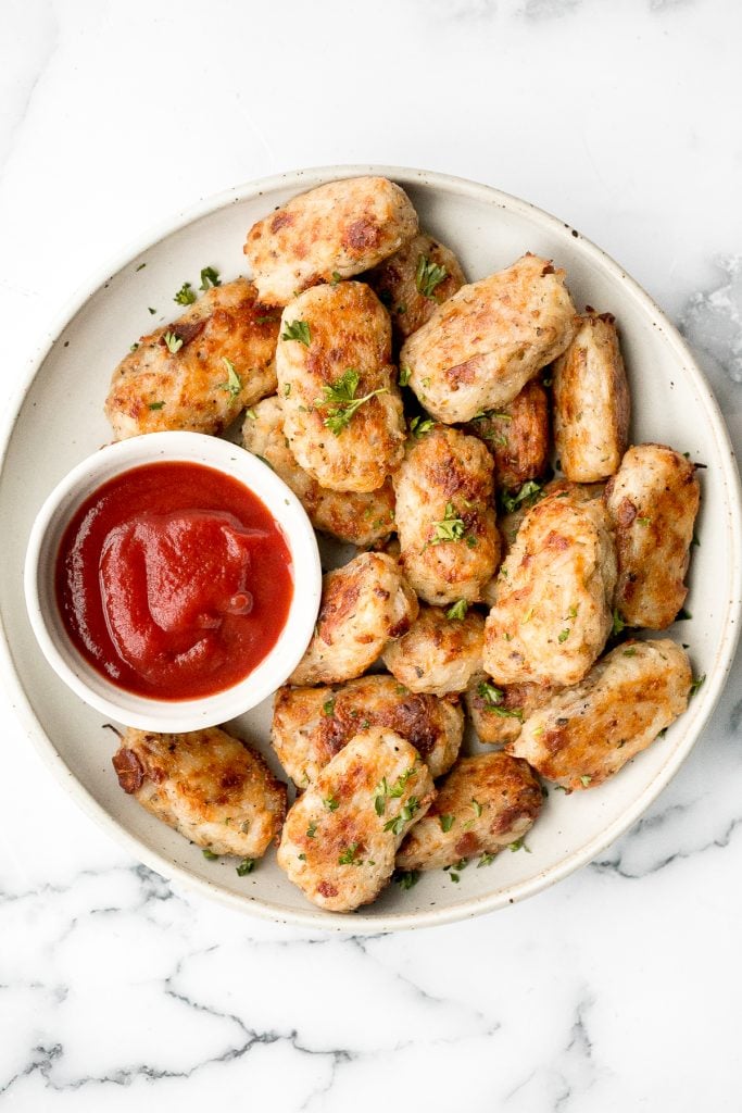 Homemade tater tots with bacon are golden and crispy on the outside, yet soft and tender inside. They're packed with flavour and a total family favourite. | aheadofthyme.com