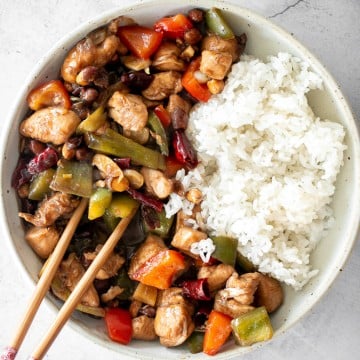 Kung Pao chicken is a Chinese chicken dish that is stir-fried with crisp vegetables and tossed in a delicious Asian sauce packed with flavour. | aheadofthyme.com