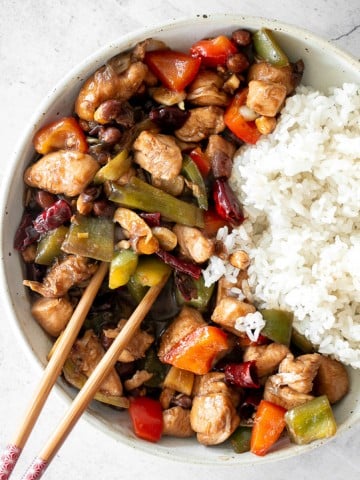 Kung Pao chicken is a Chinese chicken dish that is stir-fried with crisp vegetables and tossed in a delicious Asian sauce packed with flavour. | aheadofthyme.com