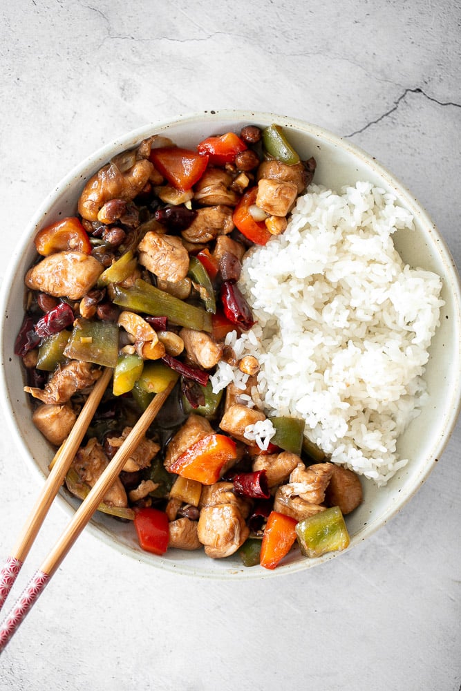 Kung Pao chicken is a Chinese chicken dish that is stir-fried with crisp vegetables and tossed in a delicious Asian sauce packed with flavour. | aheadofthyme.com