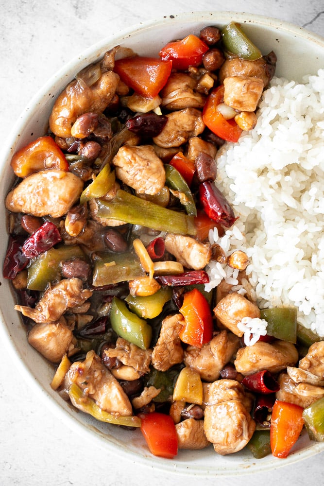 Kung Pao chicken is a Chinese chicken dish that is stir-fried with crisp vegetables and tossed in a delicious Asian sauce packed with flavour. | aheadofthyme.com